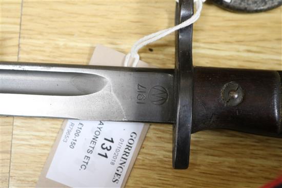 Three late 19th century French bayonets, a US Army bayonet, an EFD 1892 bayonet and an epee
